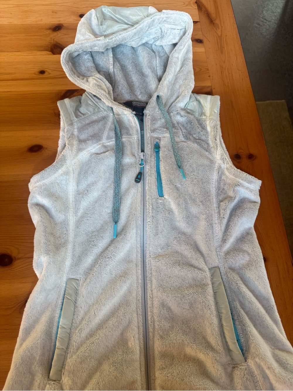 Women super soft fleece hooded vest by Outdoor Research in ice grey